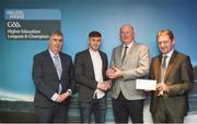 16 April 2018; Carlow IT hurler Colin Dunford from Waterford is presented with his award by Uachtarán Chumann Lúthchleas Gael John Horan, in the company of  Jim Dollard, Executive Director Electric Ireland, right, and Gerry Tully, Chairman of Comhairle Ardoideachais CLG, left, at the Electric Ireland HE GAA Football & Hurling Rising Stars Awards for 2018, in Croke Park. The awards acknowledge outstanding performances in the battle for third level football and hurling Championships and come at the end of what was an epic season of GAA action. Photo by Stephen McCarthy/Sportsfile