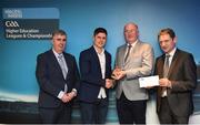 16 April 2018; UCD footballer Conor Mullally from Dublin is presented with his award by Uachtarán Chumann Lúthchleas Gael John Horan, in the company of  Jim Dollard, Executive Director Electric Ireland, right, and Gerry Tully, Chairman of Comhairle Ardoideachais CLG, left, at the Electric Ireland HE GAA Football & Hurling Rising Stars Awards for 2018, in Croke Park. The awards acknowledge outstanding performances in the battle for third level football and hurling Championships and come at the end of what was an epic season of GAA action. Photo by Stephen McCarthy/Sportsfile