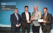 16 April 2018; DIT footballer Andrew McGowan from Dublin is presented with his award by Uachtarán Chumann Lúthchleas Gael John Horan, in the company of  Jim Dollard, Executive Director Electric Ireland, right, and Gerry Tully, Chairman of Comhairle Ardoideachais CLG, left, at the Electric Ireland HE GAA Football & Hurling Rising Stars Awards for 2018, in Croke Park. The awards acknowledge outstanding performances in the battle for third level football and hurling Championships and come at the end of what was an epic season of GAA action. Photo by Stephen McCarthy/Sportsfile