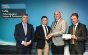 16 April 2018; Ulster University footballer Mark Bradley from Tyrone is presented with his award by Uachtarán Chumann Lúthchleas Gael John Horan, in the company of Jim Dollard, Executive Director of Electric Ireland, right, and Gerry Tully, Chairman of Comhairle Ardoideachais CLG, left, at the Electric Ireland HE GAA Football & Hurling Rising Stars Awards for 2018, in Croke Park. The awards acknowledge outstanding performances in the battle for third level football and hurling Championships and come at the end of what was an epic season of GAA action. Photo by Stephen McCarthy/Sportsfile