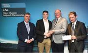 16 April 2018; Ulster University footballer Gareth McKinless from Derry is presented with his award by Uachtarán Chumann Lúthchleas Gael John Horan, in the company of Jim Dollard, Executive Director of Electric Ireland, right, and Gerry Tully, Chairman of Comhairle Ardoideachais CLG, left, at the Electric Ireland HE GAA Football & Hurling Rising Stars Awards for 2018, in Croke Park. The awards acknowledge outstanding performances in the battle for third level football and hurling Championships and come at the end of what was an epic season of GAA action. Photo by Stephen McCarthy/Sportsfile