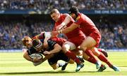 21 April 2018; Fergus McFadden of Leinster is tackled by Rhys Patchell, left, Scott Williams, centre, and Leigh Halfpenny of Scarlets during the European Rugby Champions Cup Semi-Final match between Leinster Rugby and Scarlets at the Aviva Stadium in Dublin. Photo by Ramsey Cardy/Sportsfile
