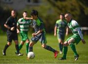 22 April 2018; Yuta Sasaki of Dublin Bus in action against Adrian Raffferty of Firhouse Clover during the Irish Daily Mail FAI Senior Cup Qualifying Round match between Dublin Bus and Firhouse Clover at Coldcut Park in Palmerstown, Dublin. Photo by Eóin Noonan/Sportsfile