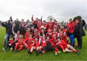 22 April 2018; Cork Youth League players, coaches and family celebrate with the trophy after the FAI Youth Interleague Cup Final match between Mayo Schoolboys & Youths Association Football League and Cork Youth League at Milebush Park in Castlebar, Mayo. Photo by Harry Murphy/Sportsfile
