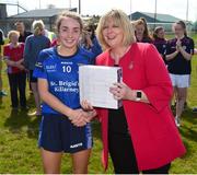 21 April 2018; Anna Clifford captain of St Brigids, S.S, Killarney is presented with the runner up medals by President of the Ladies Gaelic Football Association Maire Hickey following the Lidl All Ireland Post Primary School Junior B Final match between St Brigids, S.S, Killarney and Coláiste Bhaile Chláir, Claregalway, Galway at Mick Neville Park in Rathkeale, Limerick. Photo by Matt Browne/Sportsfile