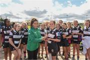 22 April 2018; Ireland international Sene Naoupu presents the cup to Orlagh Conway captain of Dundalk after the 18s Shield match between Dundalk and MU Barnhall at Navan RFC in Meath. Photo by Matt Browne/Sportsfile   Photo by Matt Browne/Sportsfile
