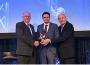 21 April 2018; Chrissy McKaigue of Slaughtneil is presented with his award by Uachtarán Chumann Lúthchleas Gael John Horan and Denis O'Callaghan, Head of AIB Retail Banking at the AIB GAA Club Player Awards at Croke Park in Dublin. Photo by Eóin Noonan/Sportsfile