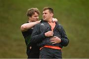 24 April 2018; CJ Stander gets some assistance with his GPS device from team-mate Chris Cloete during Munster Rugby squad training at the University of Limerick in Limerick. Photo by Diarmuid Greene/Sportsfile