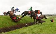 24 April 2018; Enniskillen, with Benny Walsh up, fall, as eventual winner Just Wait And See, 4, with Billy Gleeson up, and Lighting Tunes with Nile O'Rourke up, jump 'Ruby's Double' during The Kildare Hunt Club Fr Sean Breen Memorial Steeplechase for the Ladies Perpetual Cup at Punchestown Racecourse in Naas, Co. Kildare. Photo by Matt Browne/Sportsfile