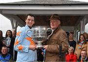 24 April 2018; Jockey Patrick Mullins and trainer Willie Mullins with the cup after winning the BoyleSports Champion Steeplechase on Un De Sceaux at Punchestown Racecourse in Naas, Co. Kildare. Photo by Matt Browne/Sportsfile