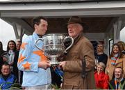 24 April 2018; Jockey Patrick Mullins and trainer Willie Mullins with the cup after winning the BoyleSports Champion Steeplechase on Un De Sceaux at Punchestown Racecourse in Naas, Co. Kildare. Photo by Matt Browne/Sportsfile