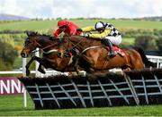 25 April 2018; Next Destination, right, with Paul Townend up, jumps the last ahead of eventual third place finisher Kilbricken Storm, left, with Harry Cobden up, on their way to winning the Irish Daily Mirror Novice Hurdle at Punchestown Racecourse in Naas, Co. Kildare. Photo by Seb Daly/Sportsfile