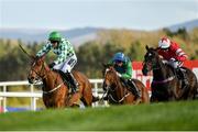 25 April 2018; Tornado Flyer, left, with Richie Deegan up, races alongside eventual third place Carefully Selected, centre, with Derek O'Connor up, and eventual second place Blockbow, right, with Patrick Mullins up, on their way to winning the Racing Post Champions INH Flat Race at Punchestown Racecourse in Naas, Co. Kildare. Photo by Seb Daly/Sportsfile