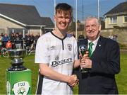 29 April 2018; Tramore AFC captain Tom Carney is presented with the Man of the Match award by FAI President Tony Fitzgerald after the FAI Youth Cup Final match between Tramore AFC and St Kevin's Boys at Ozier Park in Waterford. Photo by Piaras Ó Mídheach/Sportsfile