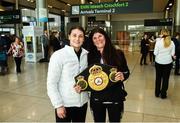 30 April 2018; Katie Taylor, who won both the WBA and IBF World Lightweight World Champion belts on Saturday night,  with the Unified WBA belt and mother Bridget Taylor on her arrival home at Dublin Airport, Dublin. Photo by David Fitzgerald/Sportsfile