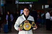 30 April 2018; Katie Taylor, who won both the WBA and IBF World Lightweight World Champion belts on Saturday night,  with the Unified WBA belt on her arrival home at Dublin Airport, Dublin. Photo by David Fitzgerald/Sportsfile