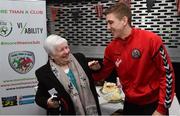 3 May 2018; Winner of the raffle for a signed Bohemians jersey Kathleen Atkinson with Bohemian FC player Oscar Brennan during the Bohemian FC: More Than A Club - Alzheimer's Awareness at the Members Bar in Dalymount Park, Co Dublin. Photo by David Fitzgerald/Sportsfile