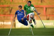 4 May 2018; Garry Hoey of Ireland in action against Jamie Tregaksiss of England during the Citywest Hotel EAFF Amputee Football Weeks Tournament match between Ireland and England at Dalymount Park in Dublin. Photo by Harry Murphy/Sportsfile