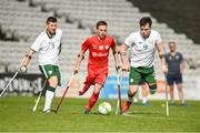 5 April 2018; Krystian Kaplon, centre, of Poland in action against David Saunders, left, and James Boyle, right, of Ireland during the Citywest Hotel EAFF Amputee Football Weeks Tournament match between Ireland and Poland at Dalymount Park in Dublin. Photo by Barry Cregg/Sportsfile