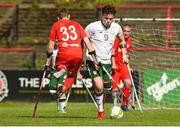 5 April 2018; James Boyle, right, of Ireland in action against Adrian Stanecki, of Poland during the Citywest Hotel EAFF Amputee Football Weeks Tournament match between Ireland and Poland at Dalymount Park in Dublin. Photo by Barry Cregg/Sportsfile
