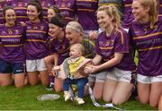 7 May 2018; Caragh Masterson, daughter of Wexford manager Anthony Masterson, sits in the cup during the celebrations after the Lidl Ladies Football National League Division 3 Final match between Meath and Wexford at St Brendan's Park, in Birr, Offaly. Photo by Piaras Ó Mídheach/Sportsfile