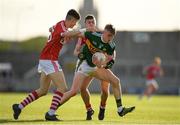 8 May 2018; Darragh Lyne of Kerry is tackled by Conor Corbett, left, and Eoin Nation of Cork during the Electric Ireland Munster GAA Football Minor Championship semi-final match between Kerry and Cork at Austin Stack Park, in Tralee, Kerry.  Photo by Eóin Noonan/Sportsfile