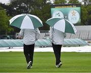 11 May 2018; Umpires Richard Illingworth, left, and Nigel Llong, right, take to the field to inspect the surface, before deciding to abandon play on day one of the International Cricket Test match between Ireland and Pakistan at Malahide, in Co. Dublin. Photo by Seb Daly/Sportsfile