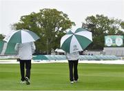 11 May 2018; Umpires Richard Illingworth, left, and Nigel Llong, right, take to the field to inspect the surface, before deciding to abandon play on day one of the International Cricket Test match between Ireland and Pakistan at Malahide, in Co. Dublin. Photo by Seb Daly/Sportsfile