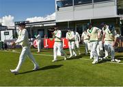 12 May 2018; Ireland captain William Porterfield, left, leads his side out prior to play on day two of the International Cricket Test match between Ireland and Pakistan at Malahide, in Co. Dublin. Photo by Seb Daly/Sportsfile