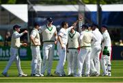 12 May 2018; Tim Murtagh of Ireland, centre, is congratulated by team-mates after claiming the wicket of Imam Ulhaq of Pakistan during day two of the International Cricket Test match between Ireland and Pakistan at Malahide, in Co. Dublin. Photo by Seb Daly/Sportsfile
