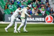 12 May 2018; Paul Stiring of Ireland, right, is congratulated by team-mate Niall O'Brien after catching out Sarfraz Ahmed of Pakistan, off a delivery from Stuart Thompson, during day two of the International Cricket Test match between Ireland and Pakistan at Malahide, in Co. Dublin. Photo by Seb Daly/Sportsfile