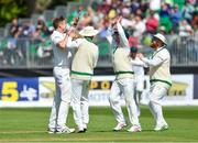 12 May 2018; Boyd Rankin of Ireland, left, is congratulated by team-mates after taking the wicket of Asad Shafiq of Pakistan during day two of the International Cricket Test match between Ireland and Pakistan at Malahide, in Co. Dublin. Photo by Seb Daly/Sportsfile