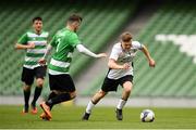 12 May 2018; Jake Corrigan of Maynooth University Town in action against Peter O'Donnell of Firhouse Clover during the FAI New Balance Intermediate Cup Final match between Firhouse Clover and Maynooth University Town at the Aviva Stadium in Dublin. Photo by Eóin Noonan/Sportsfile