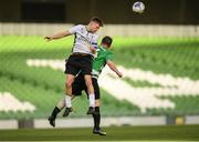 12 May 2018; Jake Corrigan of Maynooth University Town in action against Gerry Bambrick of Firhouse Clover during the FAI New Balance Intermediate Cup Final match between Firhouse Clover and Maynooth University Town at the Aviva Stadium in Dublin. Photo by Eóin Noonan/Sportsfile