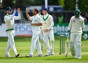 13 May 2018; Stuart Thompson of Ireland, centre, is congratulated by team-mate Andrew Balbirnie, left, after taking the wicket of Faheem Ashraf of Pakistan, right, who was caught by wicket-keeper Niall O'Brien, during day three of the International Cricket Test match between Ireland and Pakistan at Malahide, in Co. Dublin. Photo by Seb Daly/Sportsfile