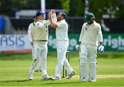 13 May 2018; Stuart Thompson of Ireland, centre, is congratulated by team-mate William Porterfield after taking the wicket of Faheem Ashraf of Pakistan, right, who was caught by wicket-keeper Niall O'Brien, during day three of the International Cricket Test match between Ireland and Pakistan at Malahide, in Co. Dublin. Photo by Seb Daly/Sportsfile
