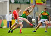 13 May 2018; Gerard McSorley of Louth kicks a point under pressure from Jordan Morrissey of Carlow during the Leinster GAA Football Senior Championship Preliminary Round match between Louth and Carlow at O'Moore Park in Laois. Photo by Harry Murphy/Sportsfile