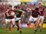 13 May 2018; Kevin McLoughlin of Mayo in action against Gareth Bradshaw of Galway during the Connacht GAA Football Senior Championship Quarter-Final match between Mayo and Galway at Elvery's MacHale Park in Mayo. Photo by Eóin Noonan/Sportsfile