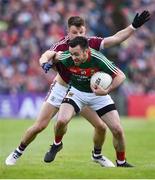 13 May 2018; Kevin McLoughlin of Mayo in action against Eamonn Brannigan of Galway during the Connacht GAA Football Senior Championship Quarter-Final match between Mayo and Galway at Elvery's MacHale Park in Mayo. Photo by David Fitzgerald/Sportsfile