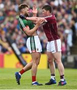 13 May 2018; Gareth Bradshaw of Galway tussles with Aidan O'Shea of Mayo during the Connacht GAA Football Senior Championship Quarter-Final match between Mayo and Galway at Elvery's MacHale Park in Mayo. Photo by David Fitzgerald/Sportsfile