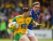 13 May 2018; Jamie Brennan of Donegal  in action against Padraig Faulkner of Cavan during the Ulster GAA Football Senior Championship Preliminary Round match between Donegal and Cavan at Páirc MacCumhaill in Donegal. Photo by Oliver McVeigh/Sportsfile