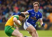 13 May 2018; Jamie Brennan of Donegal  in action against Padraig Faulkner of Cavan during the Ulster GAA Football Senior Championship Preliminary Round match between Donegal and Cavan at Páirc MacCumhaill in Donegal. Photo by Oliver McVeigh/Sportsfile