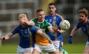 13 May 2018; Anton Sullivan of Offaly in action against Wicklow's, from left, Mark Kenny, Seán Furlong, and Kevin Murphy during the Leinster GAA Football Senior Championship Preliminary Round match between Offaly and Wicklow at O'Moore Park in Laois. Photo by Piaras Ó Mídheach/Sportsfile