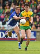 13 May 2018; Michael Langan of Donegal in action against Killian Clarke of Cavan  during the Ulster GAA Football Senior Championship Preliminary Round match between Donegal and Cavan at Páirc MacCumhaill in Donegal. Photo by Oliver McVeigh/Sportsfile