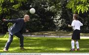 12 August 2003; Sky Sports soccer analyst Andy Gray practices some headers with Liverpool fan Kenneth Kelly, aged 10, from Dublin, at a photocall to highlight Sky Sports live coverage of the Barclaycard Premiership which kicks off this Saturday with the game between Portsmouth and Aston Villa. Soccer. Picture credit; Brendan Moran / SPORTSFILE *EDI*