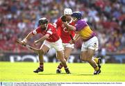 16 August 2003; Ben O'Connor, Cork, in action against Wexford's Liam Dunne. Guinness All-Ireland Senior Hurling Championship Semi-Final replay, Cork v Wexford, Croke Park, Dublin. Picture credit; Ray McManus / SPORTSFILE *EDI*