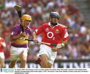 16 August 2003; Tom Kenny, Cork, in action against Wexford's Rory McCarthy. Guinness All-Ireland Senior Hurling Championship Semi-Final replay, Cork v Wexford, Croke Park, Dublin. Picture credit; Ray McManus / SPORTSFILE *EDI*