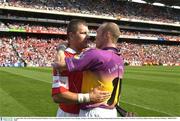 16 August 2003; Man of the Match Diarmuid O'Sullivan, Cork, is congratulated by Wexford's Larry Murphy. Guinness All-Ireland Senior Hurling Championship Semi-Final replay, Cork v Wexford, Croke Park, Dublin. Picture credit; Ray McManus / SPORTSFILE *EDI*