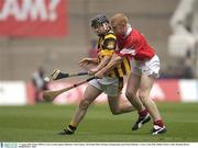 17 August 2003; Brian Clifford, Cork, in action against Kilkenny's Eoin Guinan. All-Ireland Minor Hurling Championship Semi-Final, Kilkenny v Cork, Croke Park, Dublin. Picture credit; Brendan Moran / SPORTSFILE *EDI*