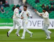 14 May 2018; Mohammad Amir of Pakistan, centre, celebrates with team-mates Imam-ul-Haq, left, and Babar Azam, right, after claiming the wicket of William Porterfield of Ireland, who was caught by wicket-keeper Sarfraz Ahmed, during day four of the International Cricket Test match between Ireland and Pakistan at Malahide, in Co. Dublin. Photo by Seb Daly/Sportsfile